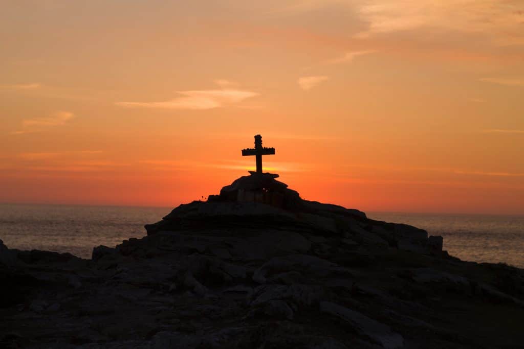 Cross Silhoutte on mountain