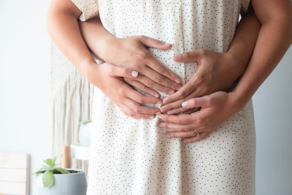 Pregnant touching belly