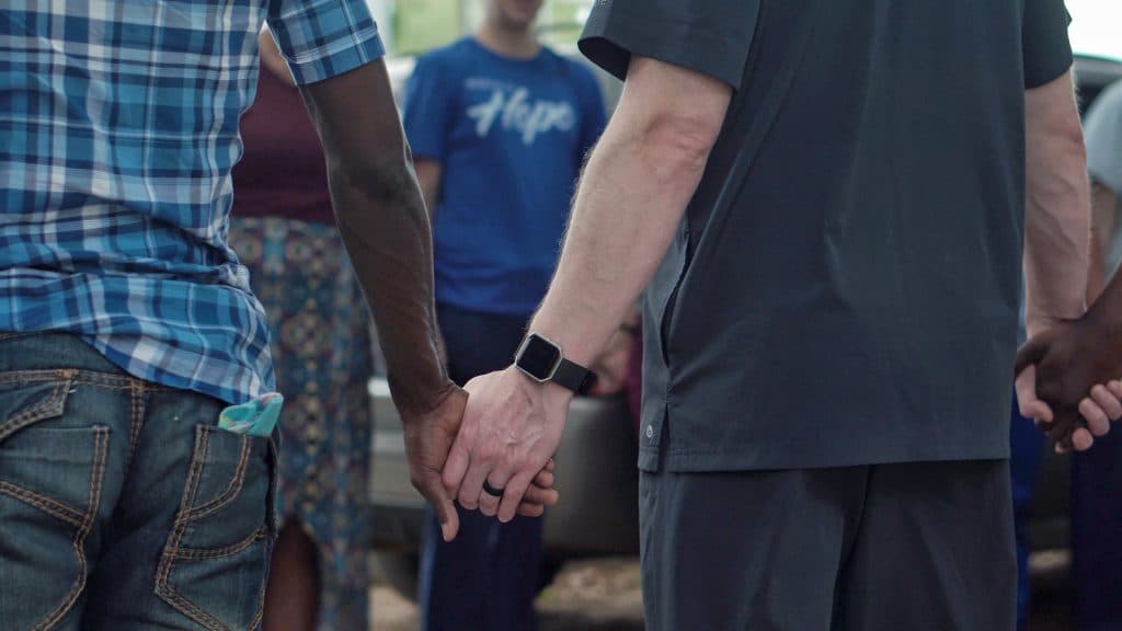 group holding hands