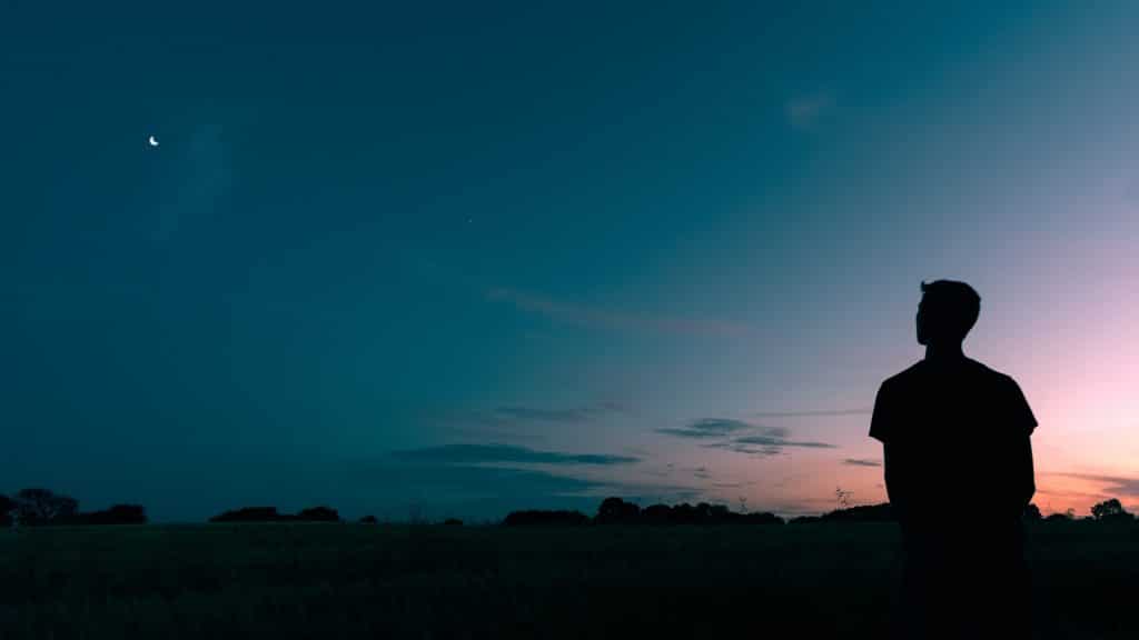 man looking at stars