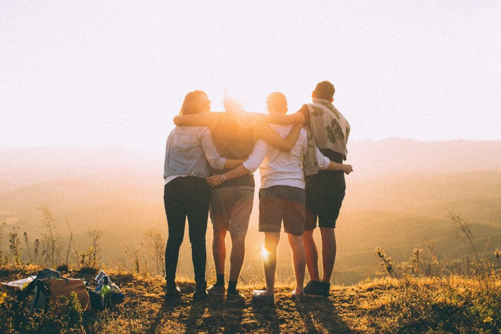 people standing together in sun