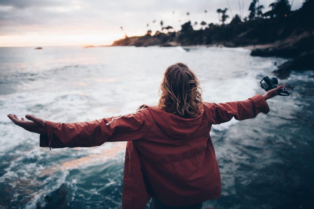 women with arms outstretched